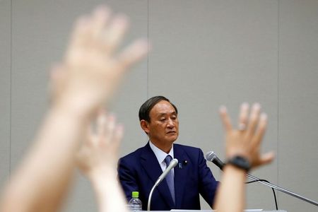 経済は持ち直しの動き＝株価のコロナ前水準回復で官房長官