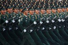 中国、24年国防費は7.2％増　台湾統一巡り「平和的」の文言削除