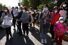 中国政府、呼吸器疾患への警戒呼びかけ　地方に報告強化も指示